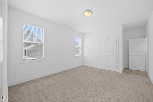 212 Aubey Ln, Wake Forest, NC 27587 - unfurnished bedroom featuring carpet flooring and baseboards