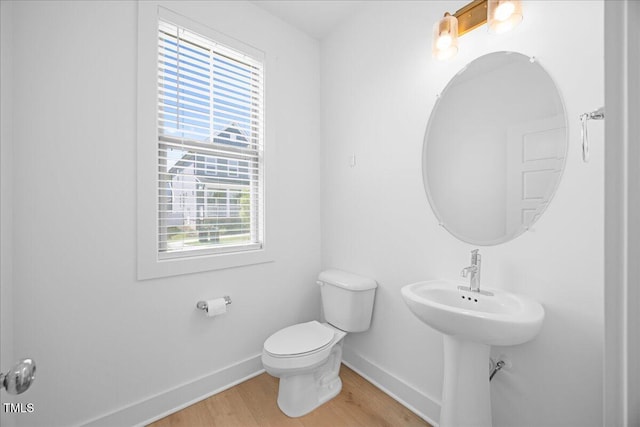 212 Aubey Ln, Wake Forest, NC 27587 - half bathroom featuring baseboards, wood finished floors, and toilet