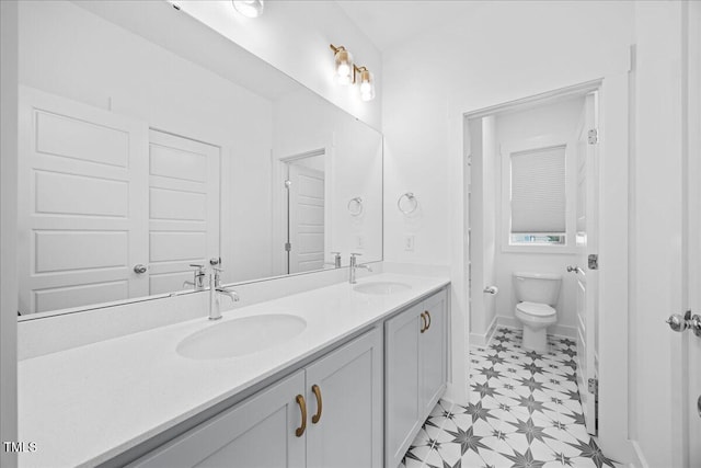212 Aubey Ln, Wake Forest, NC 27587 - full bathroom featuring double vanity, tile patterned floors, and toilet