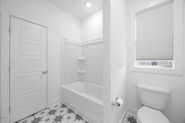 212 Aubey Ln, Wake Forest, NC 27587 - bathroom with baseboards, toilet, and washtub / shower combination