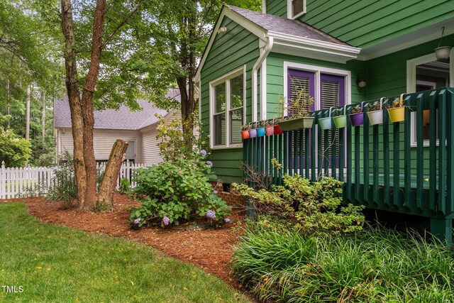 2724 Glastonbury Rd, Apex, NC 27539 - view of side of property featuring roof with shingles and a deck