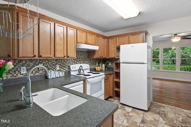 2724 Glastonbury Rd, Apex, NC 27539 - kitchen featuring white appliances, a sink, under cabinet range hood, backsplash, and a ceiling fan