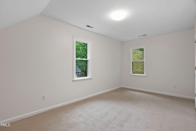 2724 Glastonbury Rd, Apex, NC 27539 - carpeted spare room with baseboards and lofted ceiling