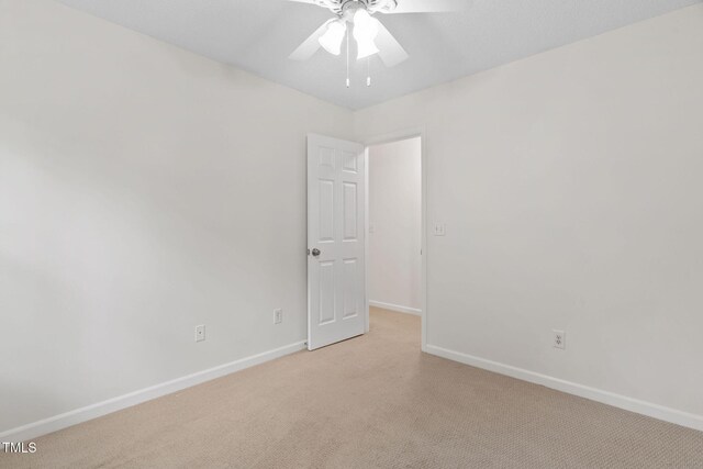 2724 Glastonbury Rd, Apex, NC 27539 - unfurnished room featuring ceiling fan, baseboards, and light colored carpet