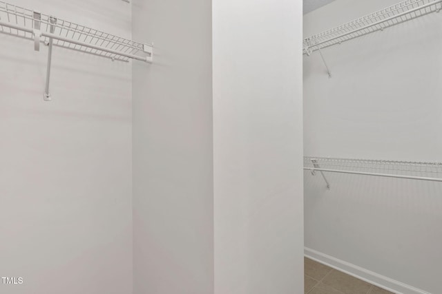 2724 Glastonbury Rd, Apex, NC 27539 - spacious closet featuring tile patterned floors