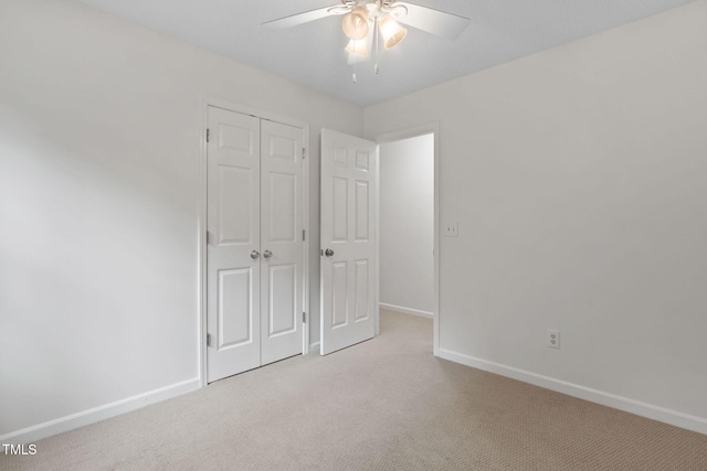 2724 Glastonbury Rd, Apex, NC 27539 - unfurnished bedroom featuring light carpet, baseboards, a closet, and a ceiling fan
