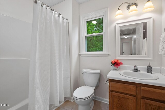 2724 Glastonbury Rd, Apex, NC 27539 - full bath featuring vanity, toilet, tile patterned flooring, shower / bath combination with curtain, and baseboards