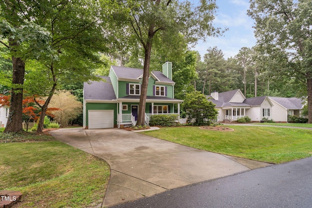 2724 Glastonbury Rd, Apex, NC 27539 - view of front facade with covered porch, an attached garage, concrete driveway, a chimney, and a front yard