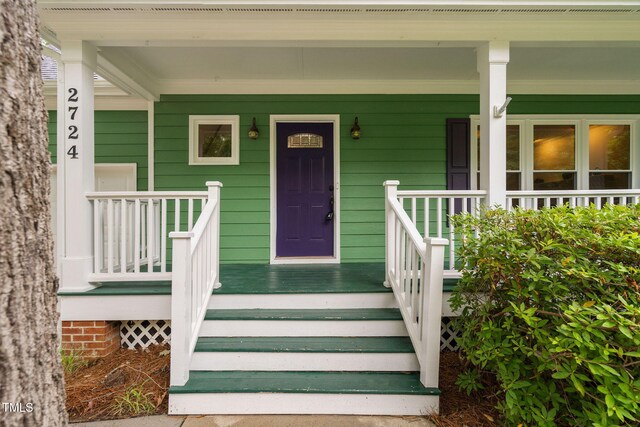 2724 Glastonbury Rd, Apex, NC 27539 - view of exterior entry featuring a porch