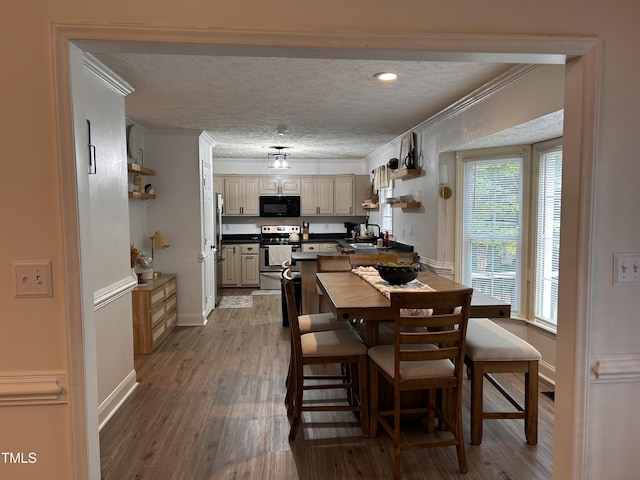 7832 Shuttle Rd, Fayetteville, NC 28311 - dining space featuring crown molding, wood finished floors, a textured ceiling, and baseboards
