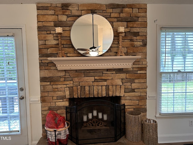 7832 Shuttle Rd, Fayetteville, NC 28311 - detailed view of a stone fireplace and a ceiling fan