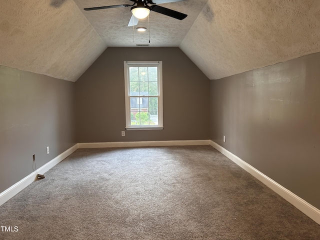 7832 Shuttle Rd, Fayetteville, NC 28311 - additional living space with a textured ceiling, carpet flooring, ceiling fan, baseboards, and lofted ceiling