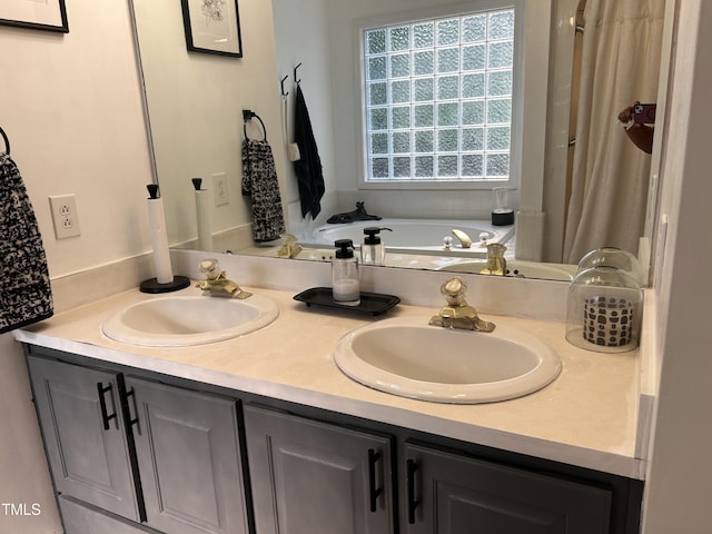 7832 Shuttle Rd, Fayetteville, NC 28311 - bathroom featuring a bath and double vanity