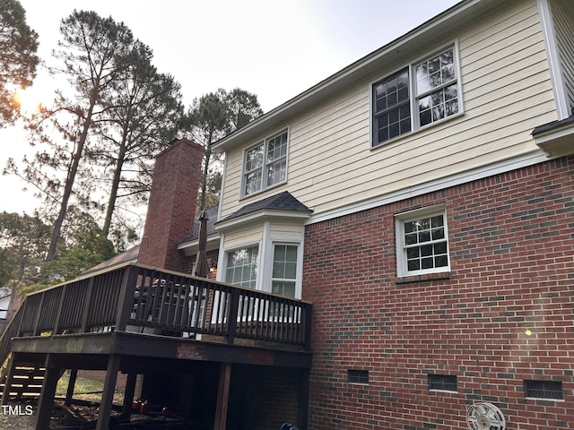7832 Shuttle Rd, Fayetteville, NC 28311 - rear view of house with a deck, crawl space, and brick siding