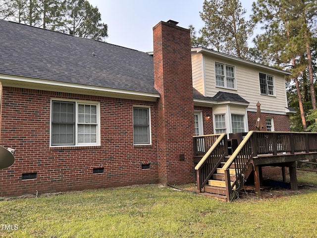7832 Shuttle Rd, Fayetteville, NC 28311 - rear view of property with crawl space, a deck, a chimney, brick siding, and a yard