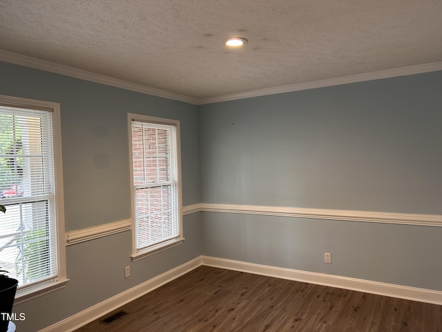 7832 Shuttle Rd, Fayetteville, NC 28311 - spare room featuring dark wood-style flooring, healthy amount of natural light, baseboards, ornamental molding, and a textured ceiling