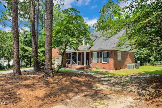 7832 Shuttle Rd, Fayetteville, NC 28311 - view of front facade with crawl space, brick siding, a porch, and roof with shingles
