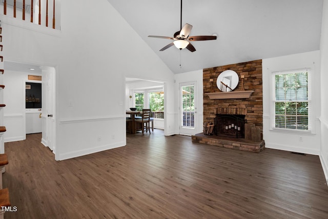 7832 Shuttle Rd, Fayetteville, NC 28311 - living area featuring high vaulted ceiling, ceiling fan, wood finished floors, and a stone fireplace