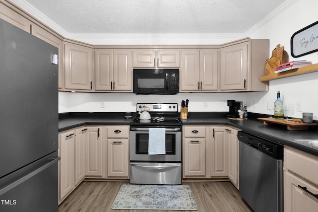 7832 Shuttle Rd, Fayetteville, NC 28311 - kitchen with appliances with stainless steel finishes, dark countertops, a textured ceiling, light wood-style floors, and ornamental molding