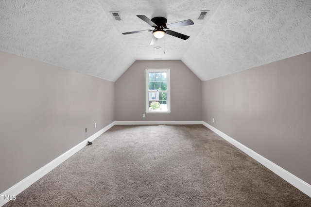 7832 Shuttle Rd, Fayetteville, NC 28311 - additional living space featuring a textured ceiling, carpet flooring, ceiling fan, and vaulted ceiling