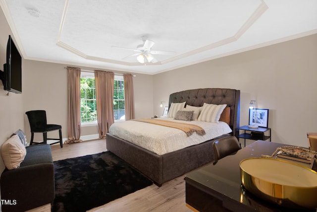 7832 Shuttle Rd, Fayetteville, NC 28311 - bedroom with a raised ceiling, wood finished floors, crown molding, and a ceiling fan