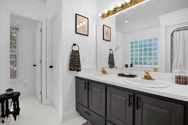 7832 Shuttle Rd, Fayetteville, NC 28311 - full bathroom featuring double vanity and baseboards
