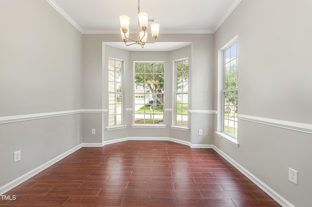 2409 Valley Haven Dr, Raleigh, NC 27603 - spare room featuring a chandelier, healthy amount of natural light, ornamental molding, and dark wood finished floors