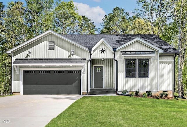 205 Shawnee Dr, Louisburg, NC 27549 - modern farmhouse with a standing seam roof, driveway, roof with shingles, board and batten siding, and a garage