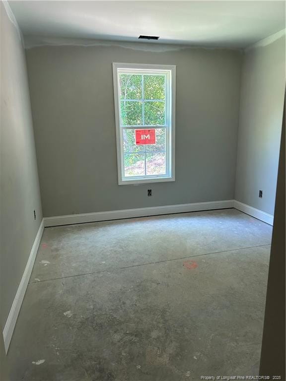 6207 Glenlea Cir, Fayetteville, NC 28314 - empty room with unfinished concrete floors and crown molding