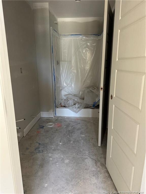6207 Glenlea Cir, Fayetteville, NC 28314 - bathroom with curtained shower and concrete floors