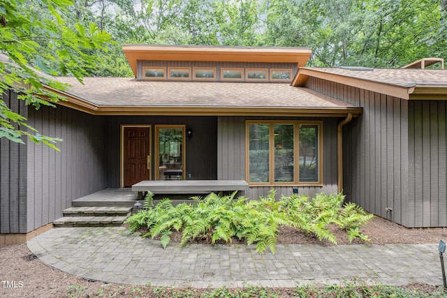 6 Womble Cir, Durham, NC 27705 - view of exterior entry with covered porch and roof with shingles