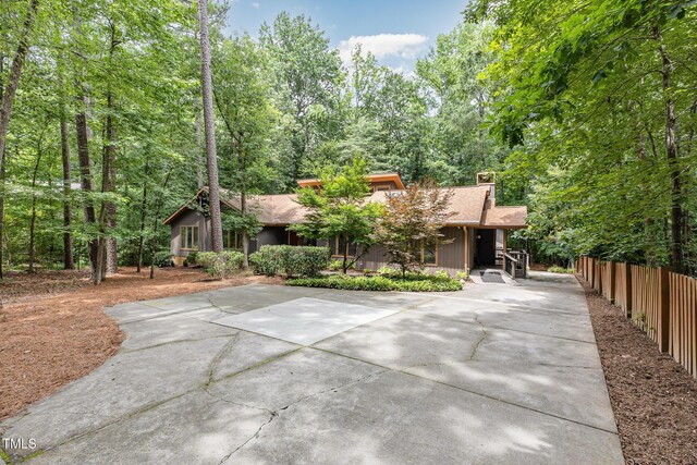 6 Womble Cir, Durham, NC 27705 - view of front of property with concrete driveway and a chimney