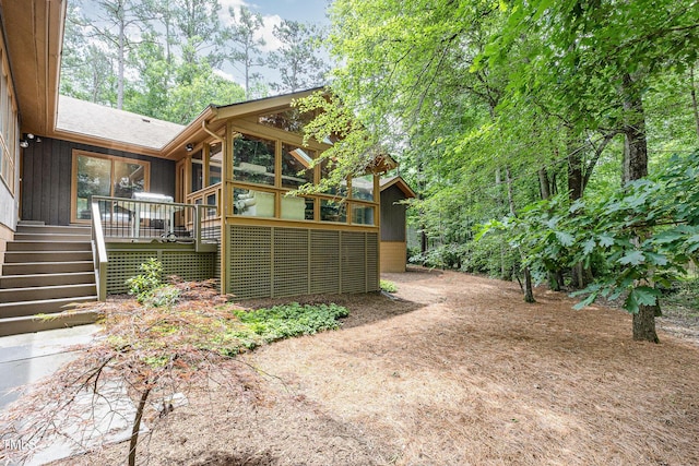 6 Womble Cir, Durham, NC 27705 - view of yard featuring a sunroom and stairway