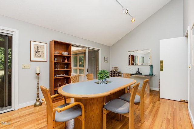 6 Womble Cir, Durham, NC 27705 - dining space with light wood-style flooring, high vaulted ceiling, and track lighting