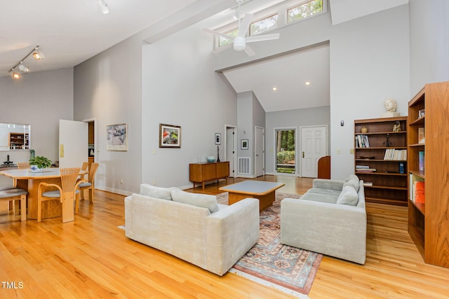 6 Womble Cir, Durham, NC 27705 - living room with a towering ceiling, a ceiling fan, track lighting, and light wood finished floors