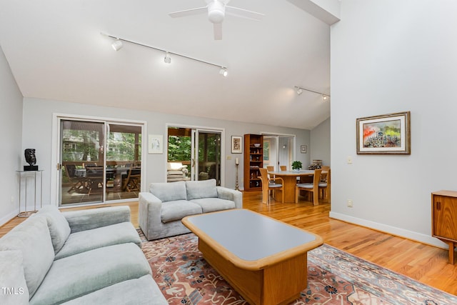 6 Womble Cir, Durham, NC 27705 - living room featuring rail lighting, light wood-style flooring, ceiling fan, and vaulted ceiling
