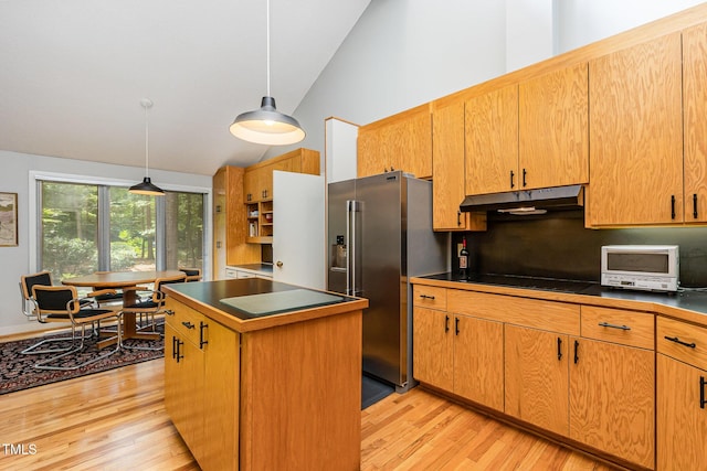 6 Womble Cir, Durham, NC 27705 - kitchen featuring high end refrigerator, under cabinet range hood, light wood finished floors, dark countertops, and a center island