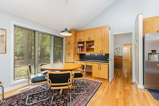 6 Womble Cir, Durham, NC 27705 - dining room featuring vaulted ceiling and light wood-style flooring