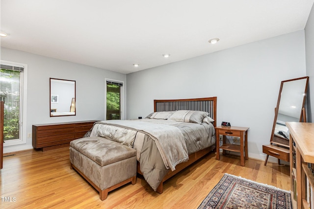 6 Womble Cir, Durham, NC 27705 - bedroom with light wood finished floors and recessed lighting