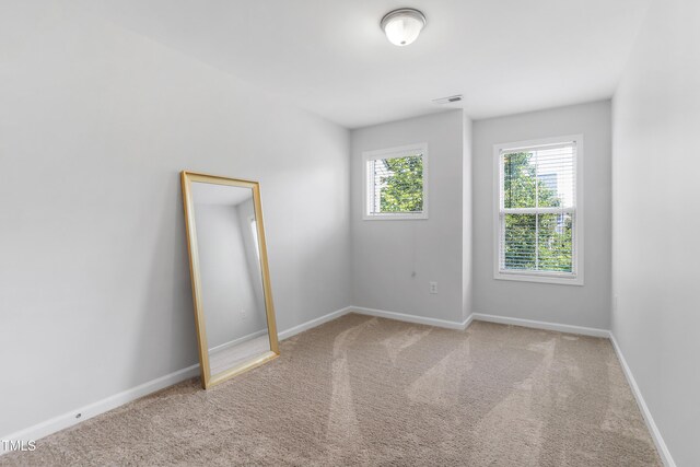 412 Heritage Village Ln, Apex, NC 27502 - carpeted spare room featuring baseboards
