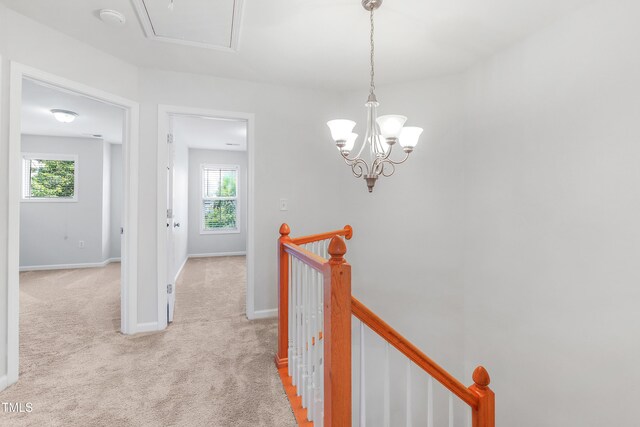 412 Heritage Village Ln, Apex, NC 27502 - hallway with an upstairs landing, light carpet, plenty of natural light, and attic access