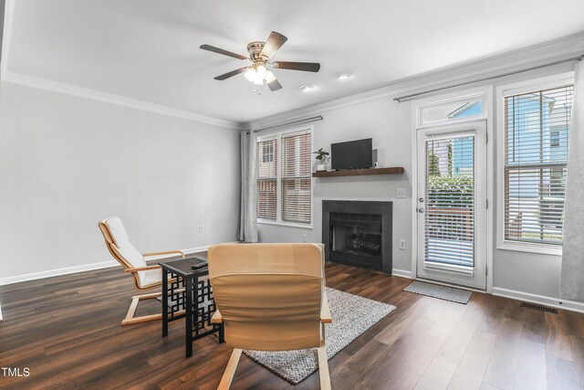 412 Heritage Village Ln, Apex, NC 27502 - living area with ornamental molding, a ceiling fan, wood finished floors, baseboards, and a fireplace