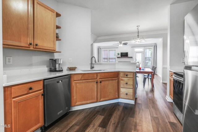 412 Heritage Village Ln, Apex, NC 27502 - kitchen featuring stainless steel appliances, a peninsula, a sink, dark wood-style flooring, and light countertops