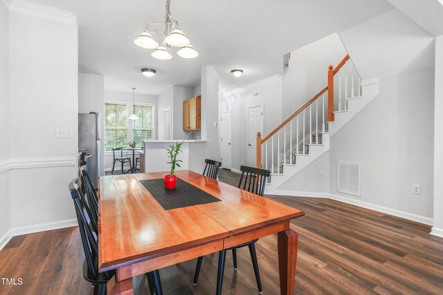 412 Heritage Village Ln, Apex, NC 27502 - dining room featuring a chandelier, baseboards, dark wood-style floors, stairway, and ornamental molding