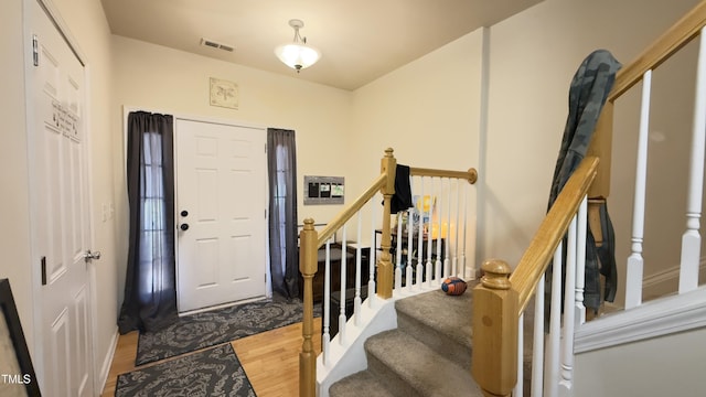 106 Gallent Hedge Trl, Apex, NC 27539 - entrance foyer with wood finished floors and stairs