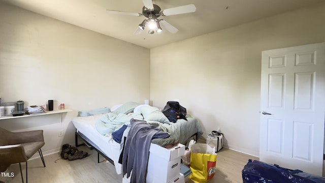 106 Gallent Hedge Trl, Apex, NC 27539 - bedroom with wood finished floors, baseboards, and ceiling fan