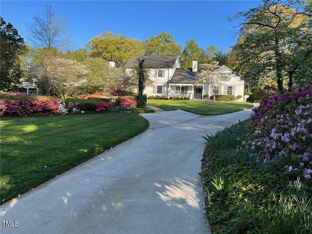 1004 E Willowbrook Dr, Burlington, NC 27215 - view of front of home with a front yard and a chimney