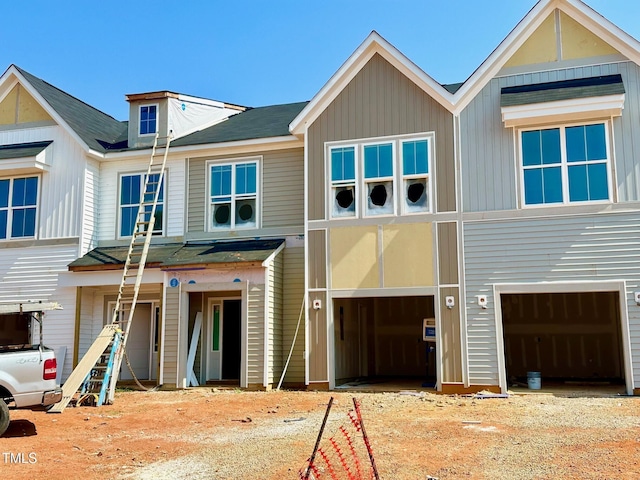 87 Ripple Way Unit 214, Clayton, NC 27520 - view of front facade featuring a garage, board and batten siding, and driveway