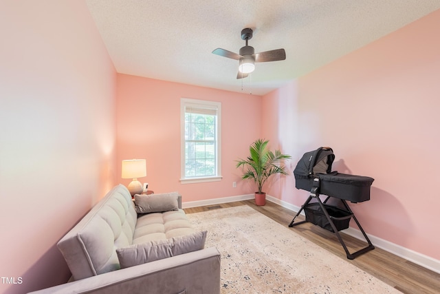358 Tillamook Dr, Wake Forest, NC 27587 - living area with wood finished floors, baseboards, and ceiling fan