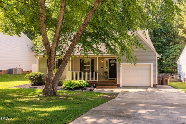 358 Tillamook Dr, Wake Forest, NC 27587 - view of front of home featuring covered porch, an attached garage, driveway, a front yard, and central AC unit